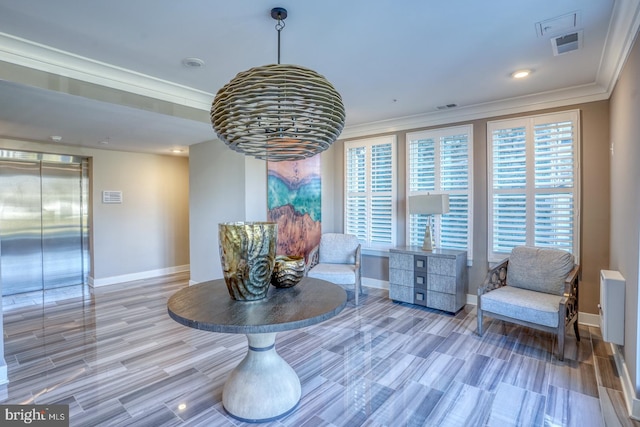 sitting room with crown molding