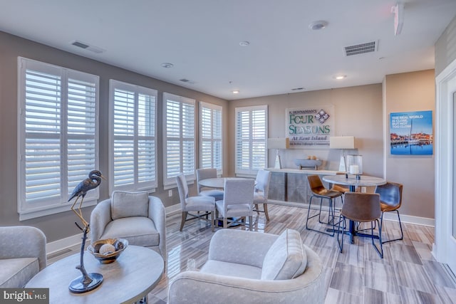 living room with light hardwood / wood-style floors