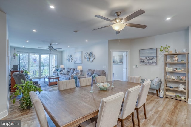 dining area featuring ceiling fan and light wood-type flooring