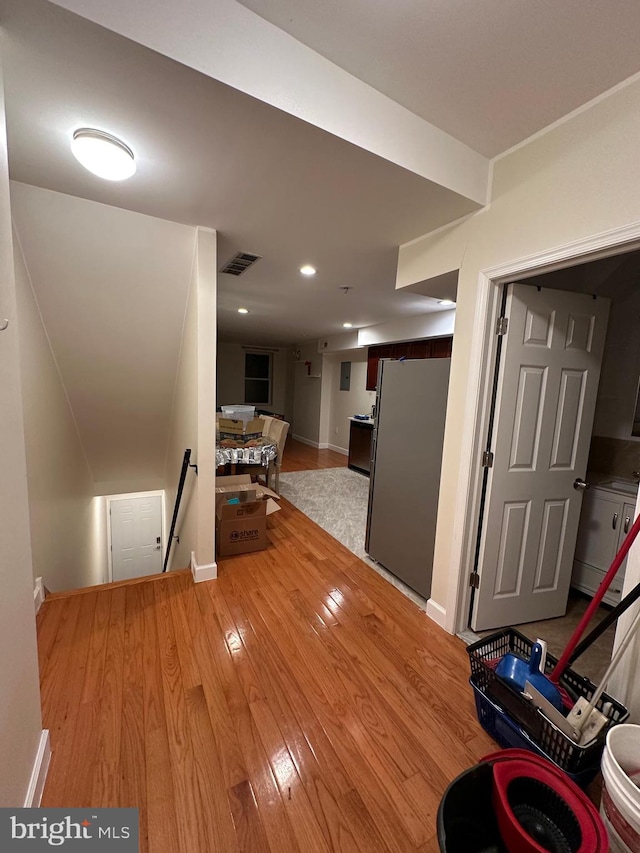 corridor featuring light hardwood / wood-style floors