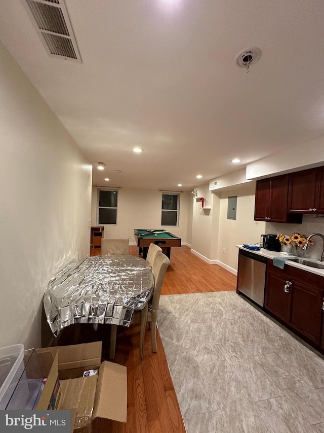 kitchen featuring pool table, dishwasher, sink, and light wood-type flooring