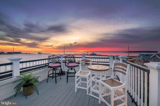 deck at dusk with a water view