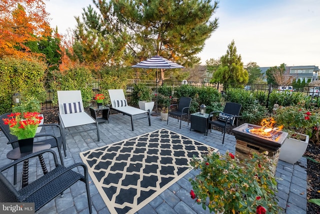 view of terrace featuring an outdoor fire pit