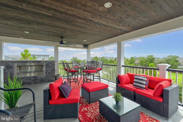 view of terrace featuring outdoor lounge area and ceiling fan