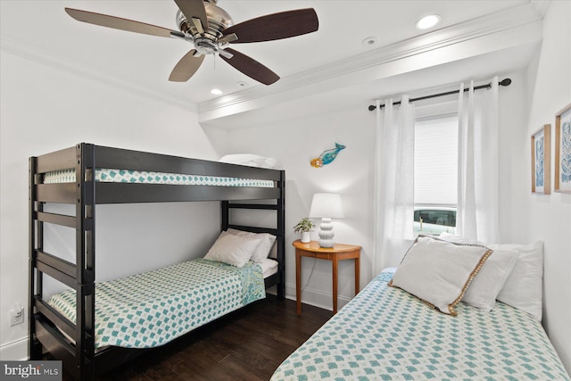 bedroom with dark hardwood / wood-style floors, ceiling fan, and ornamental molding