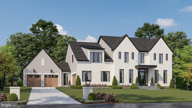 view of front of house featuring a garage and a front yard