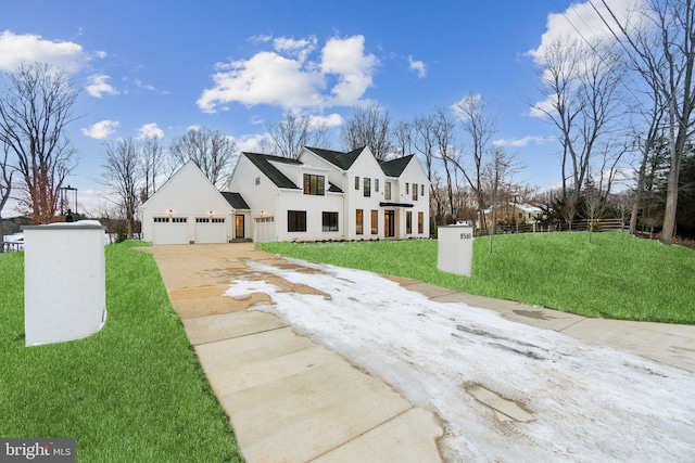 cape cod-style house with a garage and a front lawn