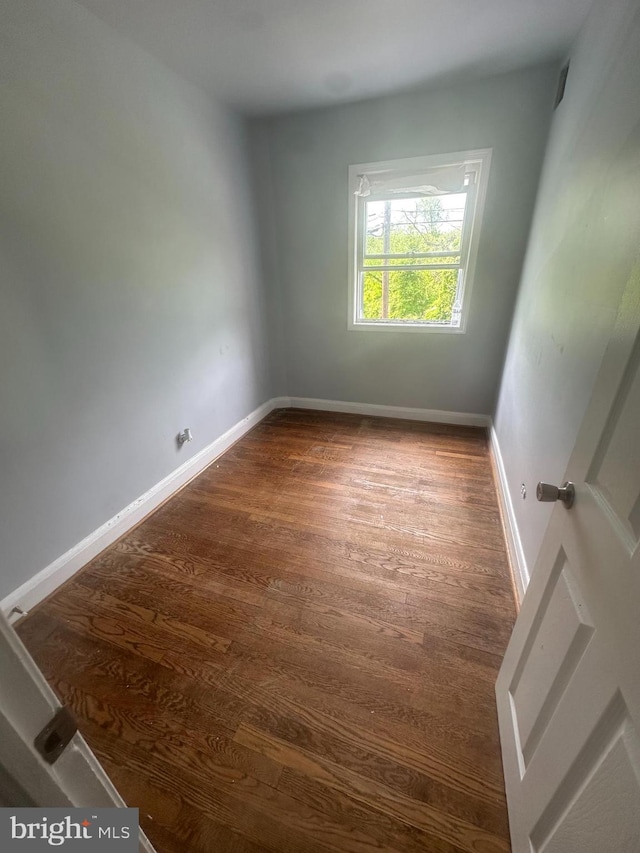 empty room featuring dark hardwood / wood-style floors