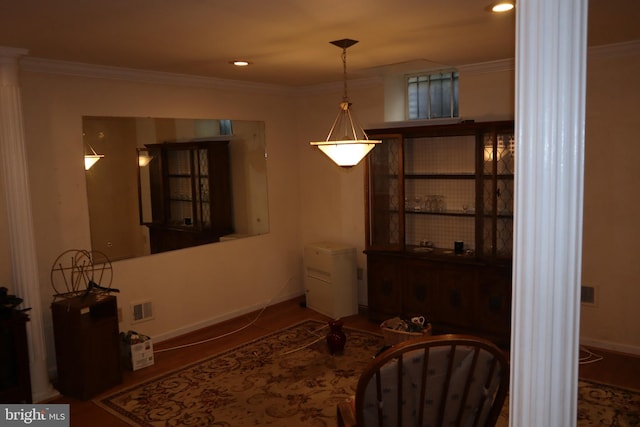 living area with crown molding