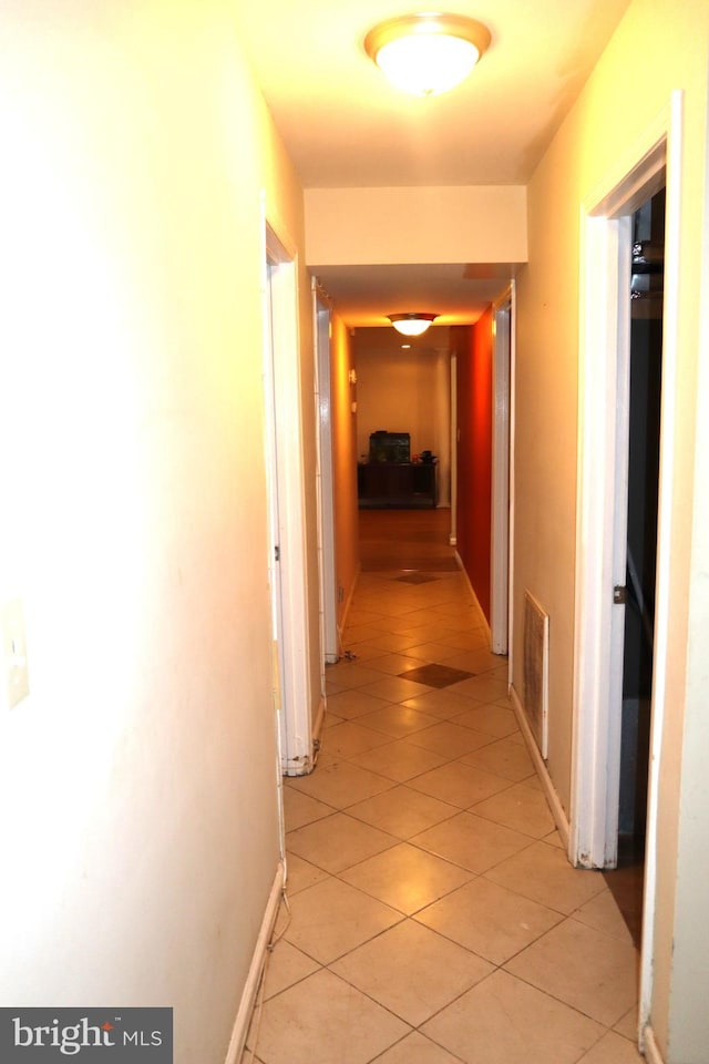 corridor with light tile floors