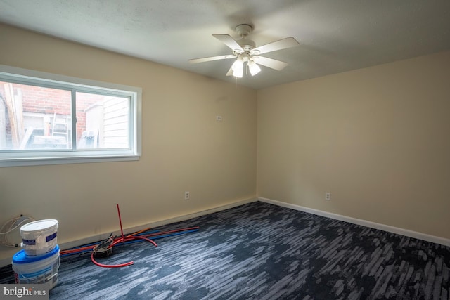 carpeted empty room with ceiling fan