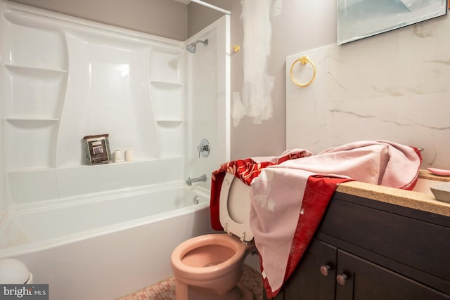 bathroom featuring tub / shower combination and toilet