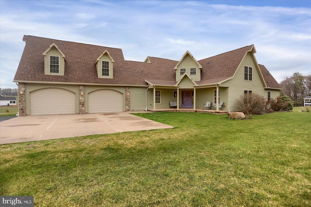 new england style home featuring a garage and a front yard