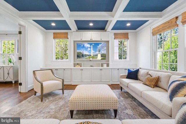 living room featuring coffered ceiling, hardwood / wood-style floors, and a healthy amount of sunlight