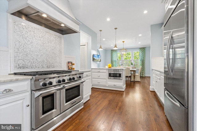 kitchen featuring white cabinets, appliances with stainless steel finishes, dark hardwood / wood-style floors, and custom range hood