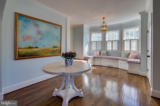 interior space featuring hardwood / wood-style flooring, a chandelier, and ornamental molding