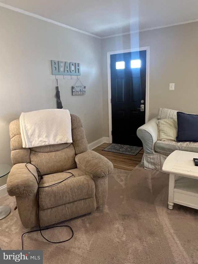 living room with wood-type flooring and crown molding