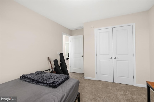 carpeted bedroom with a closet