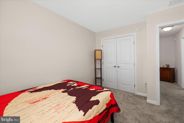 carpeted bedroom featuring a closet