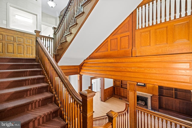 staircase with wood-type flooring