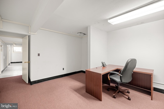 office space with beamed ceiling and carpet flooring