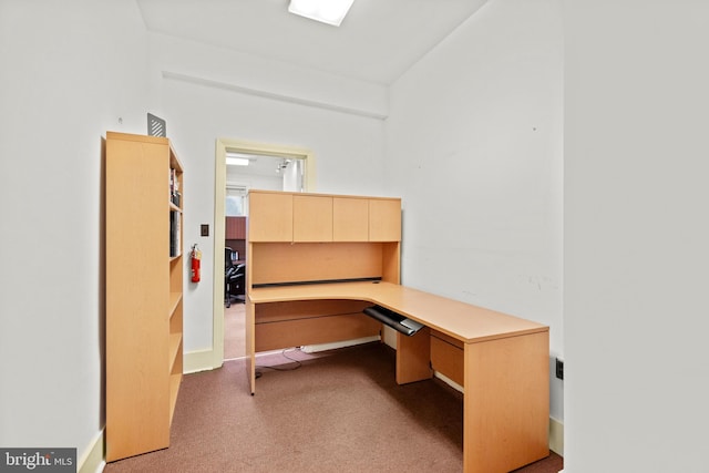 office area with light carpet and built in desk