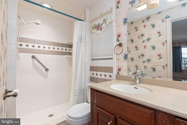 bathroom with vanity, toilet, and walk in shower