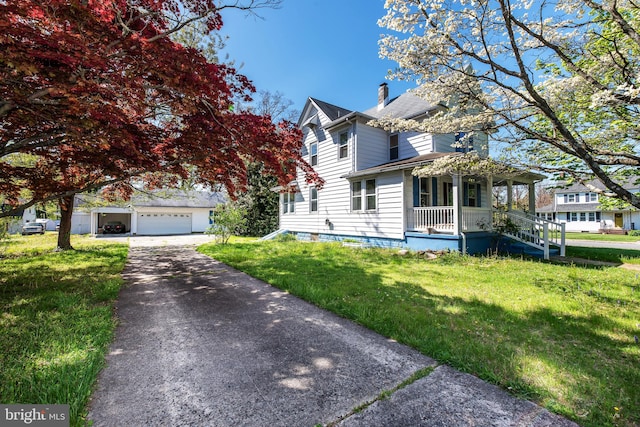 view of front of property featuring a garage and a front yard