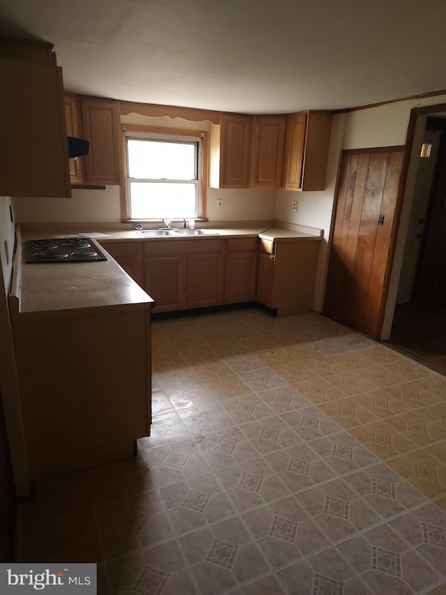 kitchen featuring sink, black gas cooktop, tile floors, and ventilation hood