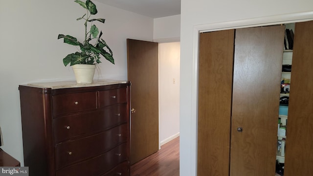 hallway featuring dark hardwood / wood-style floors