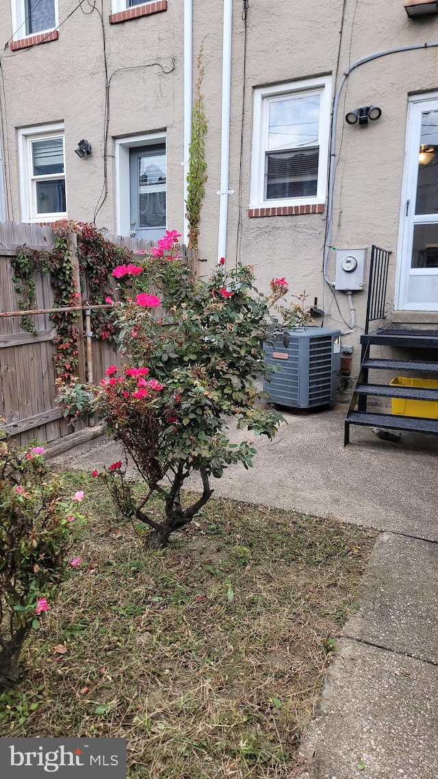 exterior space featuring central AC unit