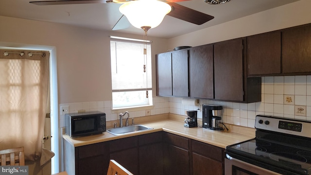 kitchen featuring ceiling fan, dark brown cabinetry, stainless steel range with electric stovetop, and tasteful backsplash