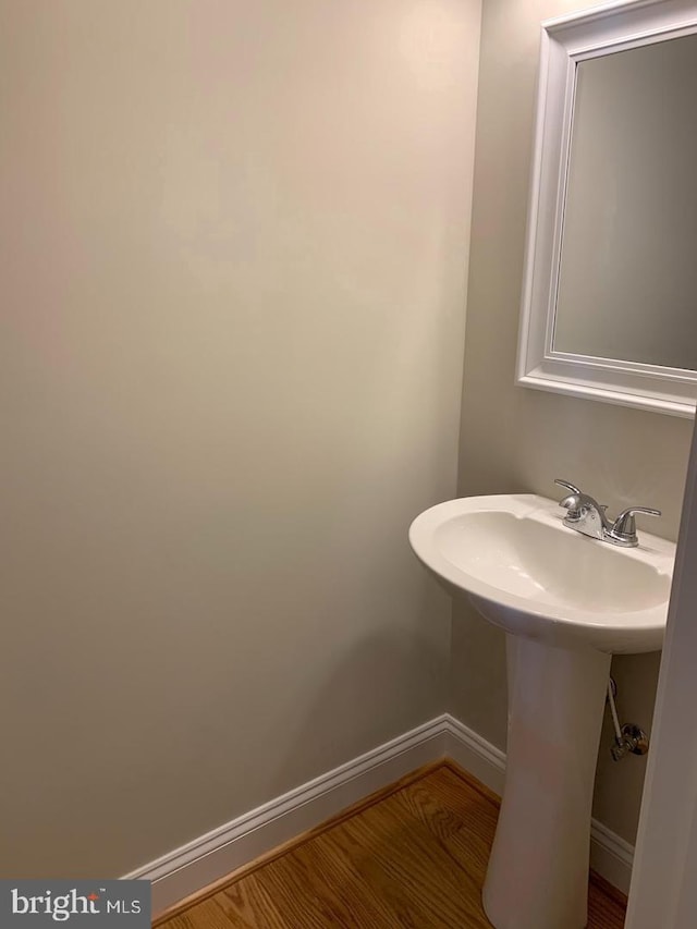 bathroom featuring sink and hardwood / wood-style floors