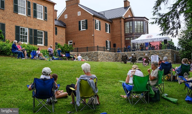 view of home's community with a lawn