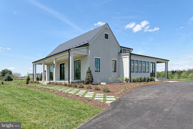 view of home's exterior featuring a yard