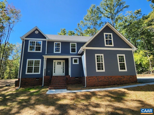 craftsman-style house with a front lawn