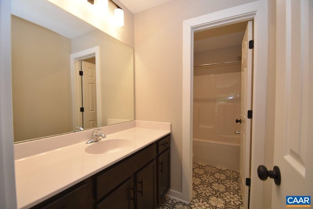 bathroom featuring vanity, tile patterned floors, and tub / shower combination