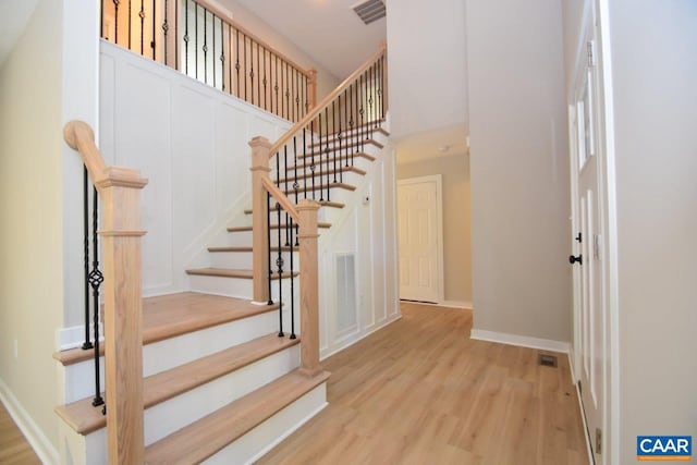 stairway featuring hardwood / wood-style flooring