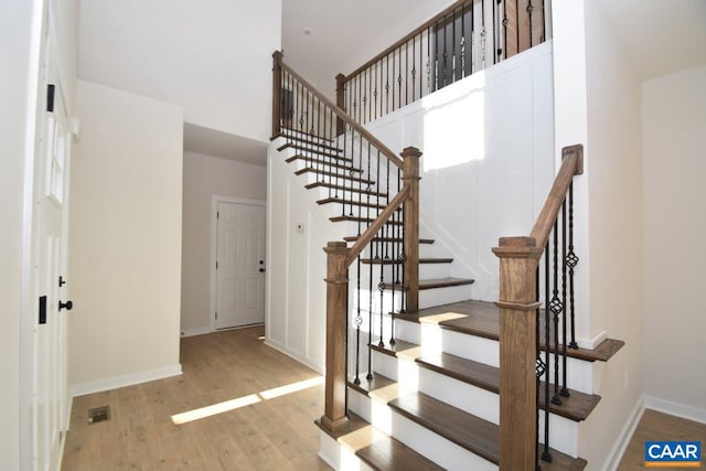 staircase featuring hardwood / wood-style flooring