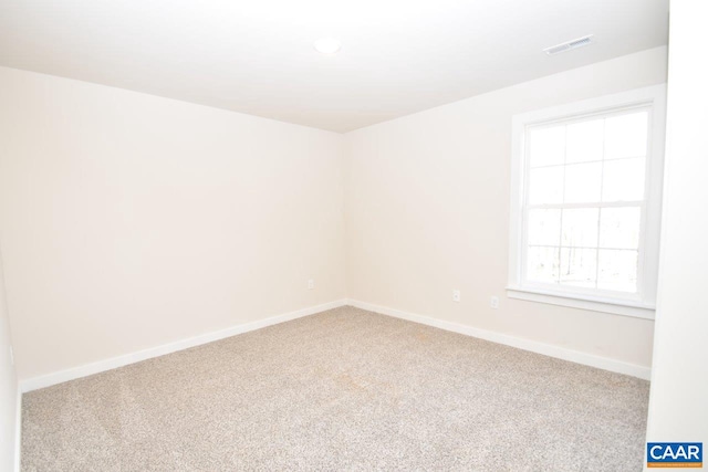 unfurnished room featuring carpet