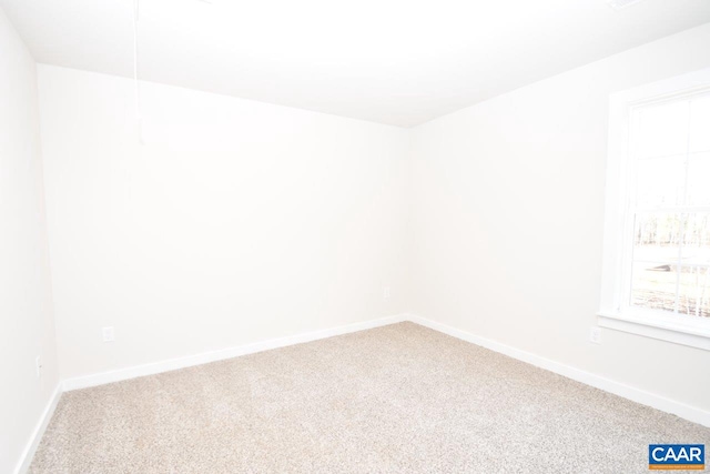 spare room featuring carpet floors