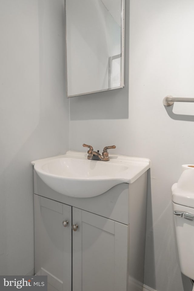 bathroom with toilet and vanity