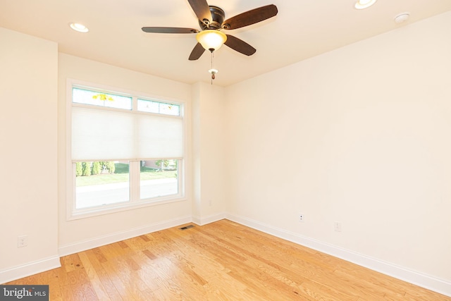 unfurnished room featuring light hardwood / wood-style flooring, plenty of natural light, and ceiling fan