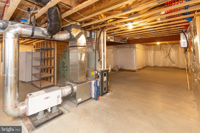 basement featuring white fridge