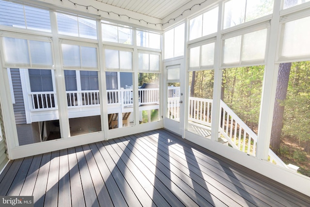 unfurnished sunroom featuring plenty of natural light