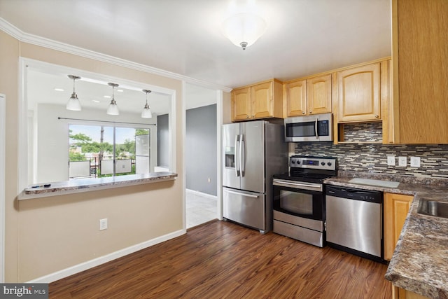 kitchen with hanging light fixtures, dark wood-type flooring, backsplash, and appliances with stainless steel finishes