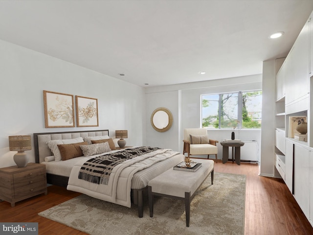 bedroom with hardwood / wood-style floors