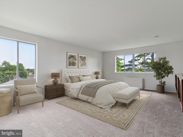 carpeted bedroom featuring multiple windows