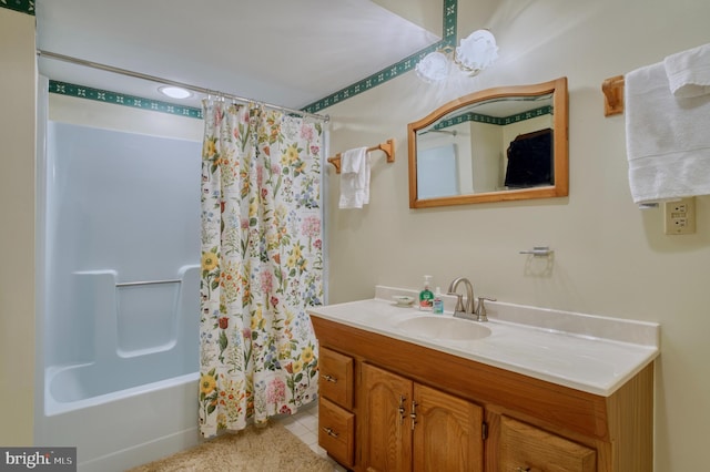 bathroom with tile flooring, large vanity, and shower / bath combo with shower curtain