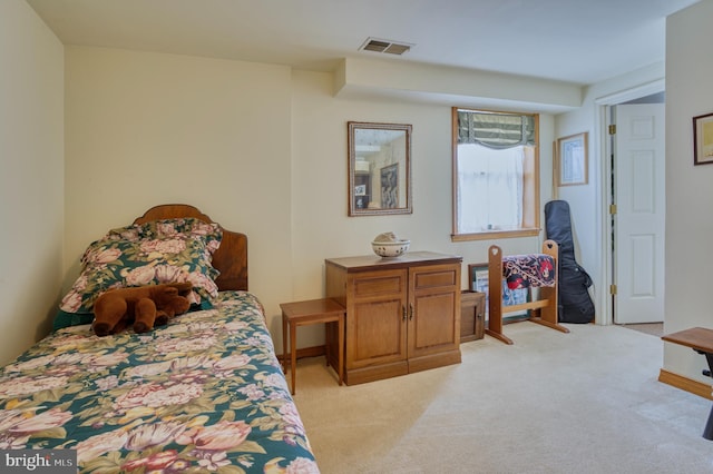 bedroom with light carpet